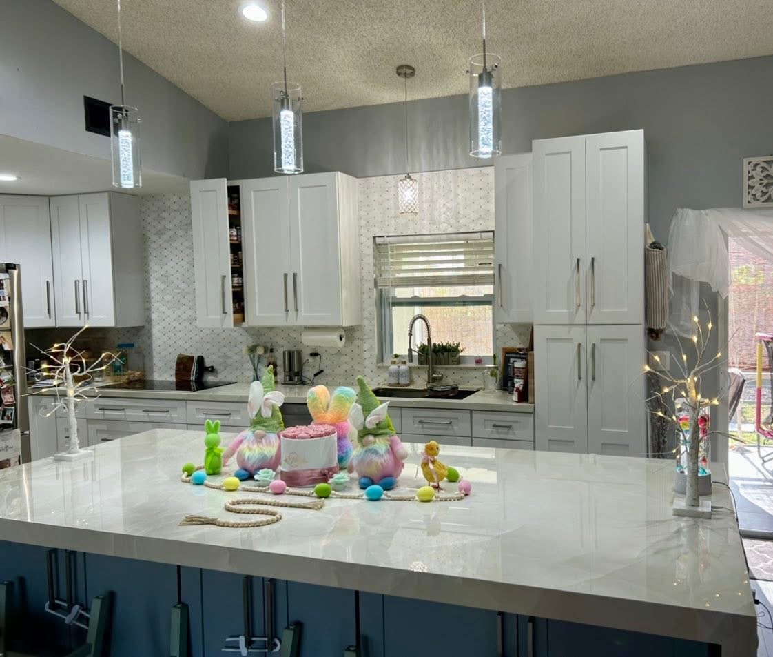 Modern kitchen with quartz waterfall island