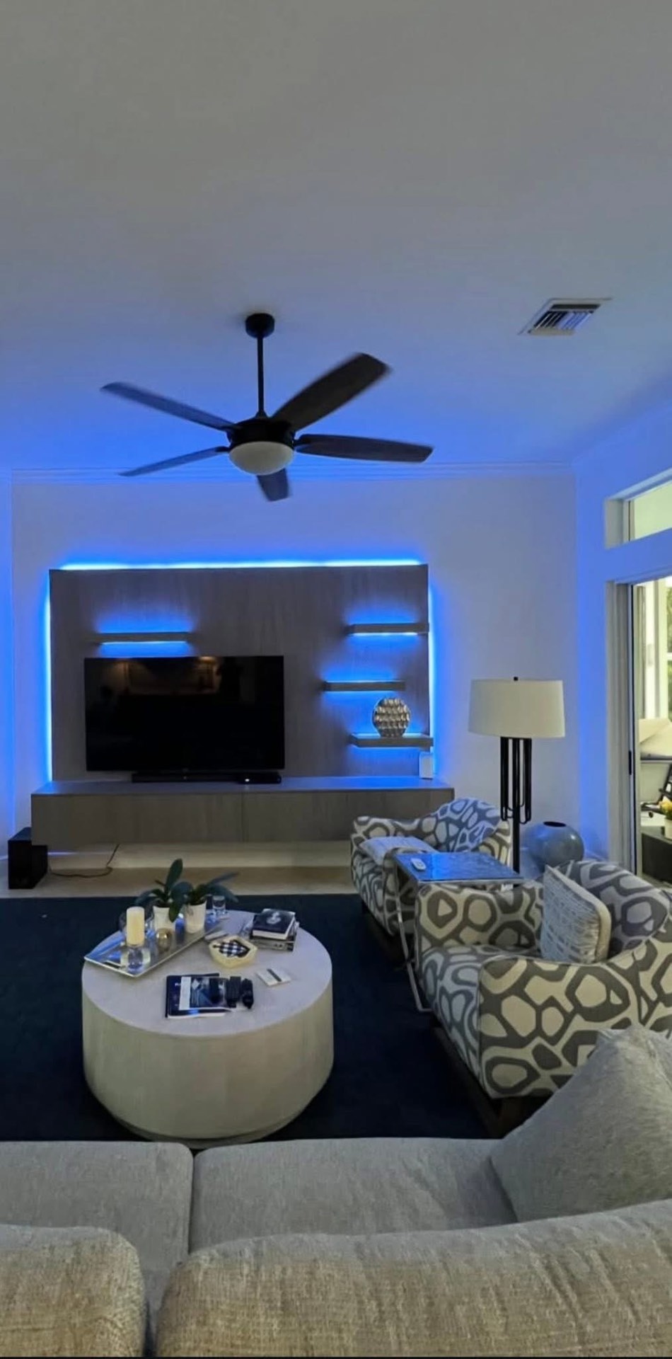 Living room with custom LED-lit media wall