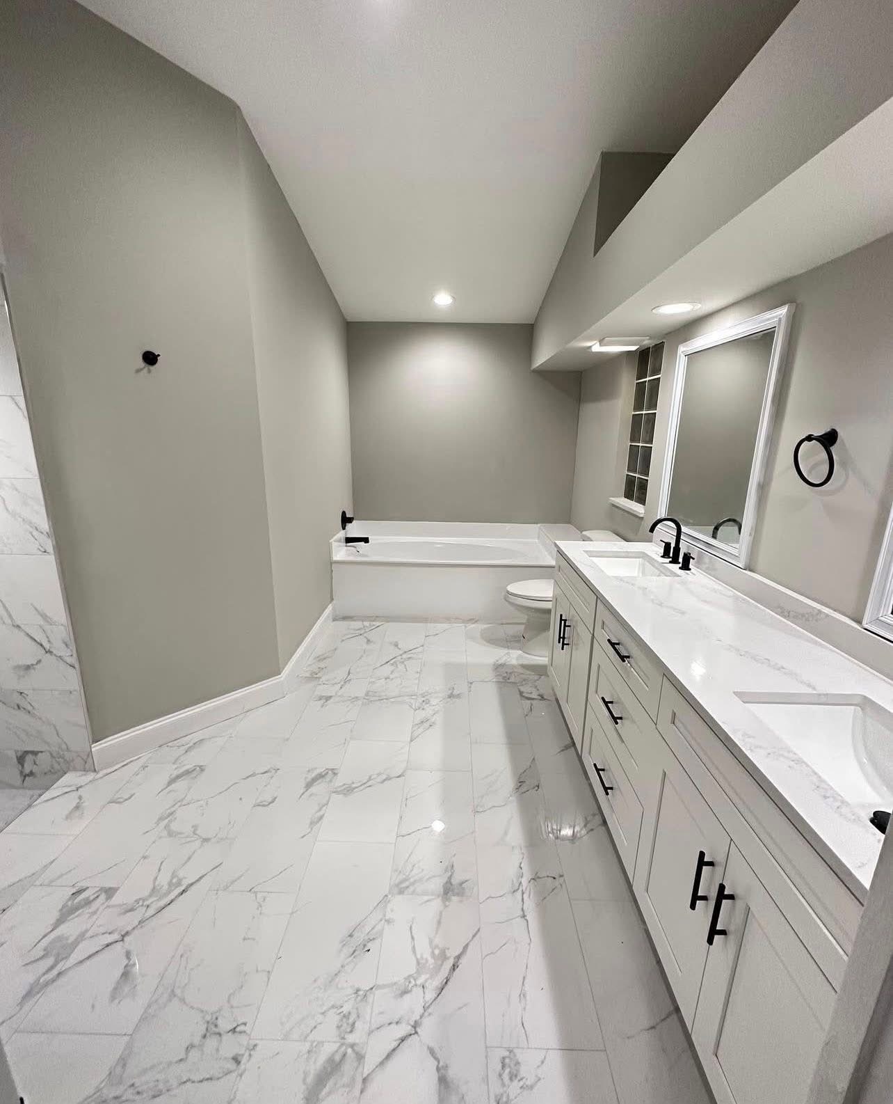Master bathroom remodel with marble floors and double vanity