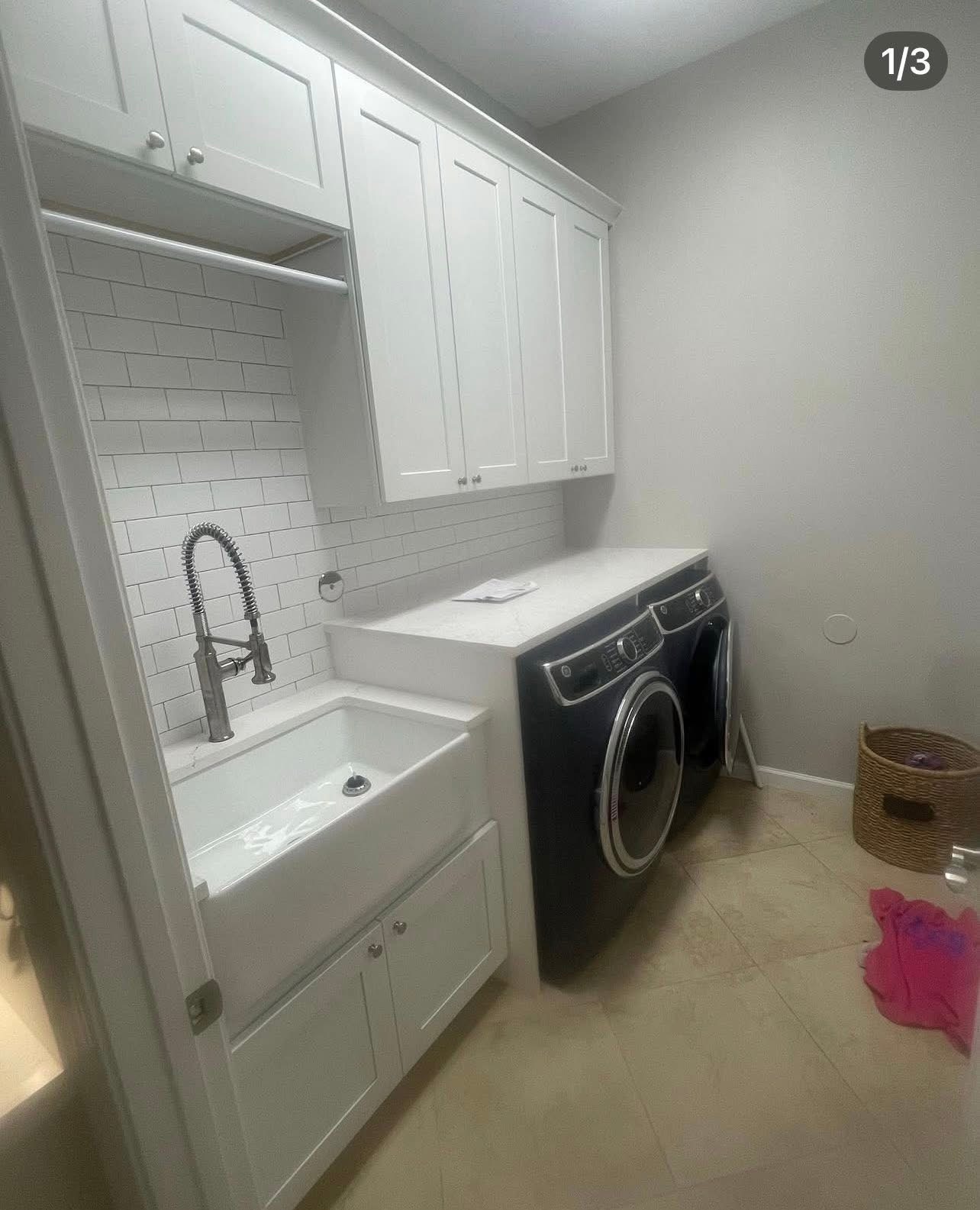 Laundry room with farmhouse sink and subway tile backsplash